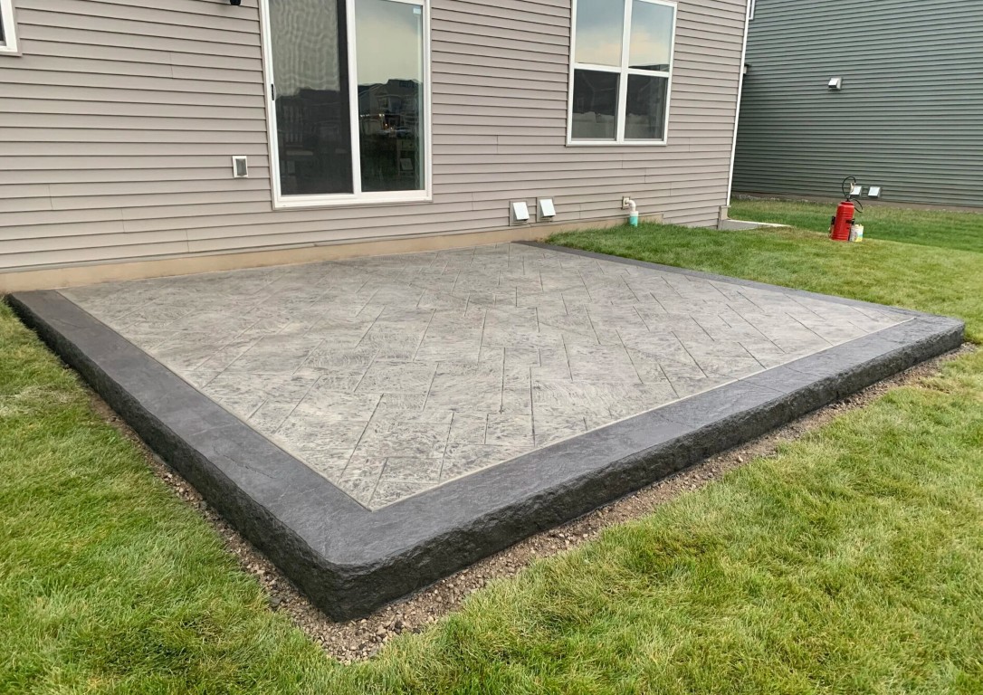 Beautiful stamped concrete patio in Weslaco backyard